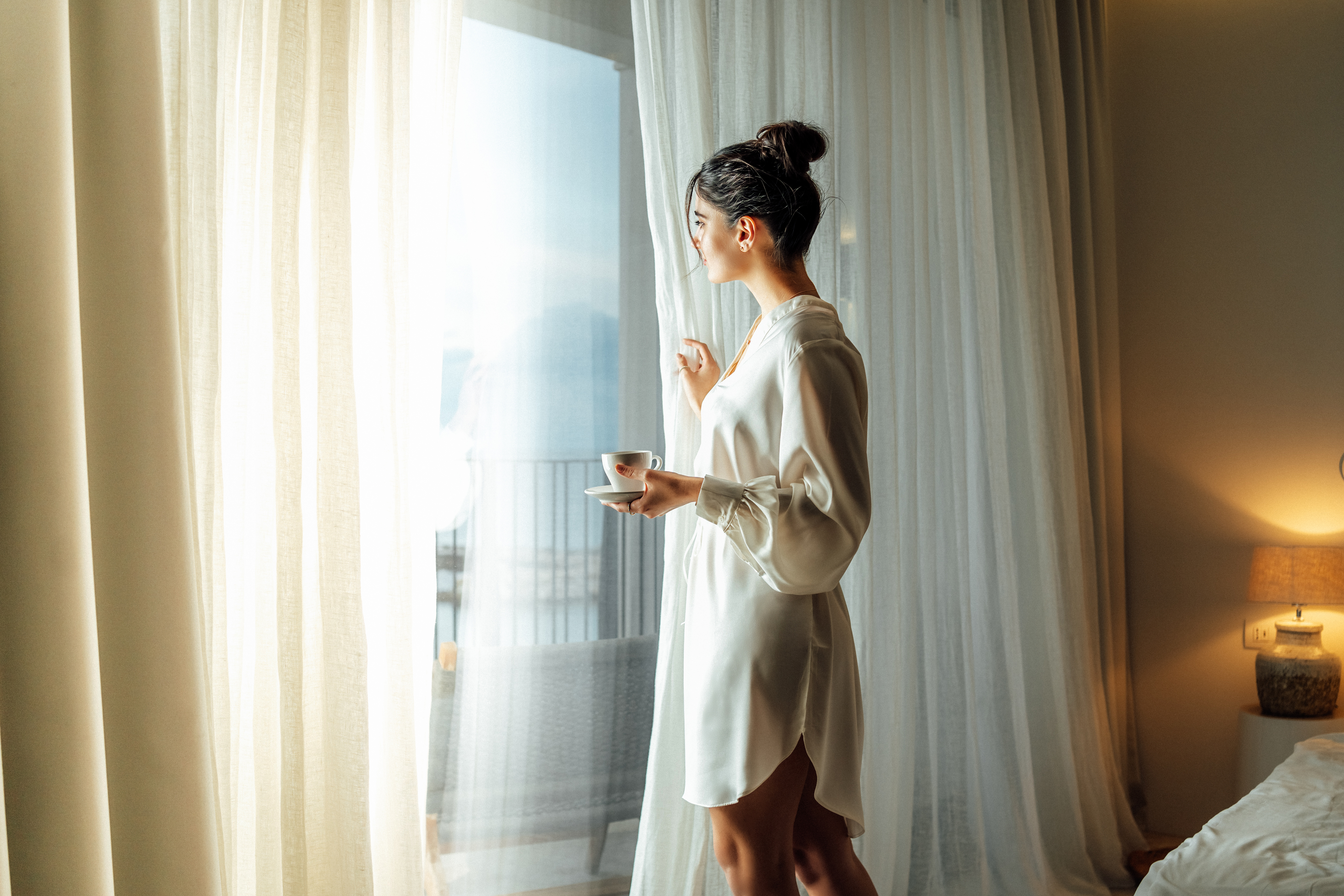 Morning light through hotel room curtains